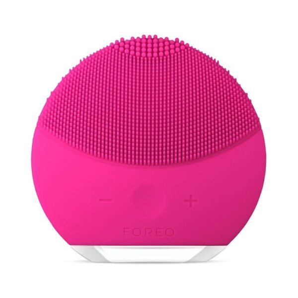 Bright pink Foreo facial cleansing device with silicone bristles and minimal front controls on a white background.