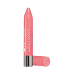 Pink lip crayon lipstick standing upright with cap removed and resting beside on white background
