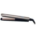 Gold and black hair straightener with a digital temperature display reading 230°C.