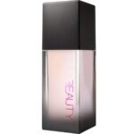 Lip gloss tube with a black cap and pale pink liquid, the word 'BEAUTY' printed along the side.