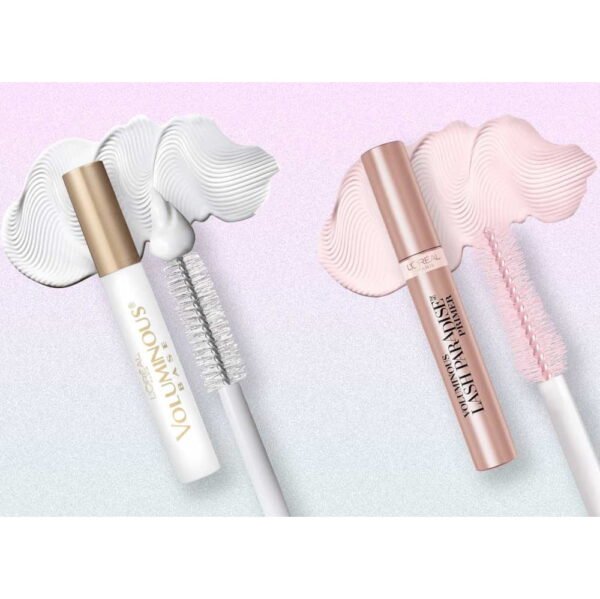 Two L’Oréal mascaras (Voluminous and Lash Paradise) lay on a pastel pink–purple backdrop with wavy cream swirls behind them.