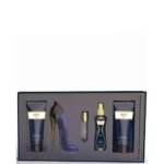 Luxurious bath and body gift set in a navy box, featuring two blue tubes, a purple high-heel sculpture, a spray bottle, and a perfume bottle.