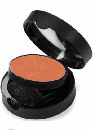 Open black cosmetic compact showing peach-orange blush with a small applicator sponge inside the case.