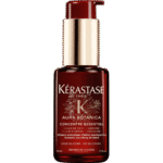 Kerastase Aura Botanica essential oil concentrate bottle with gold pump top against black background, red bottle.