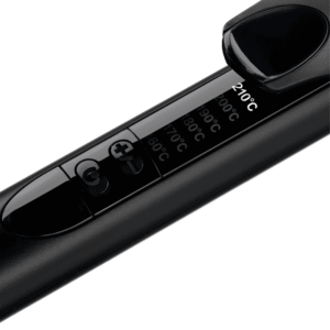 Close-up of a black digital thermometer with an LCD display showing temperatures in Celsius, angled across the frame.